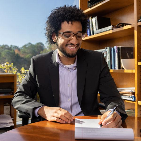 coles Management, Entrepreneurship and Hospitality student working at desk